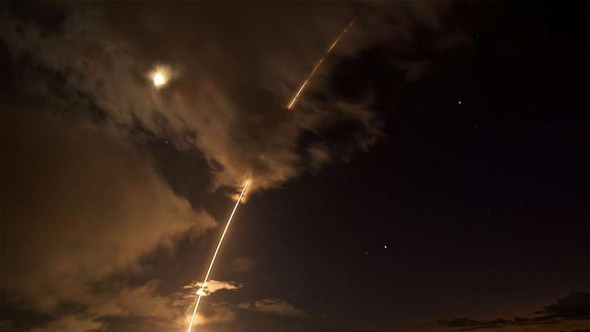 FILE PHOTO: FILE PHOTO: A medium-range ballistic missile target is launched from the Pacific Missile Range Facility, before being successfully intercepted by Standard Missile-6 missiles fired from the guided-missile destroyer USS John Paul Jones, in Kauai