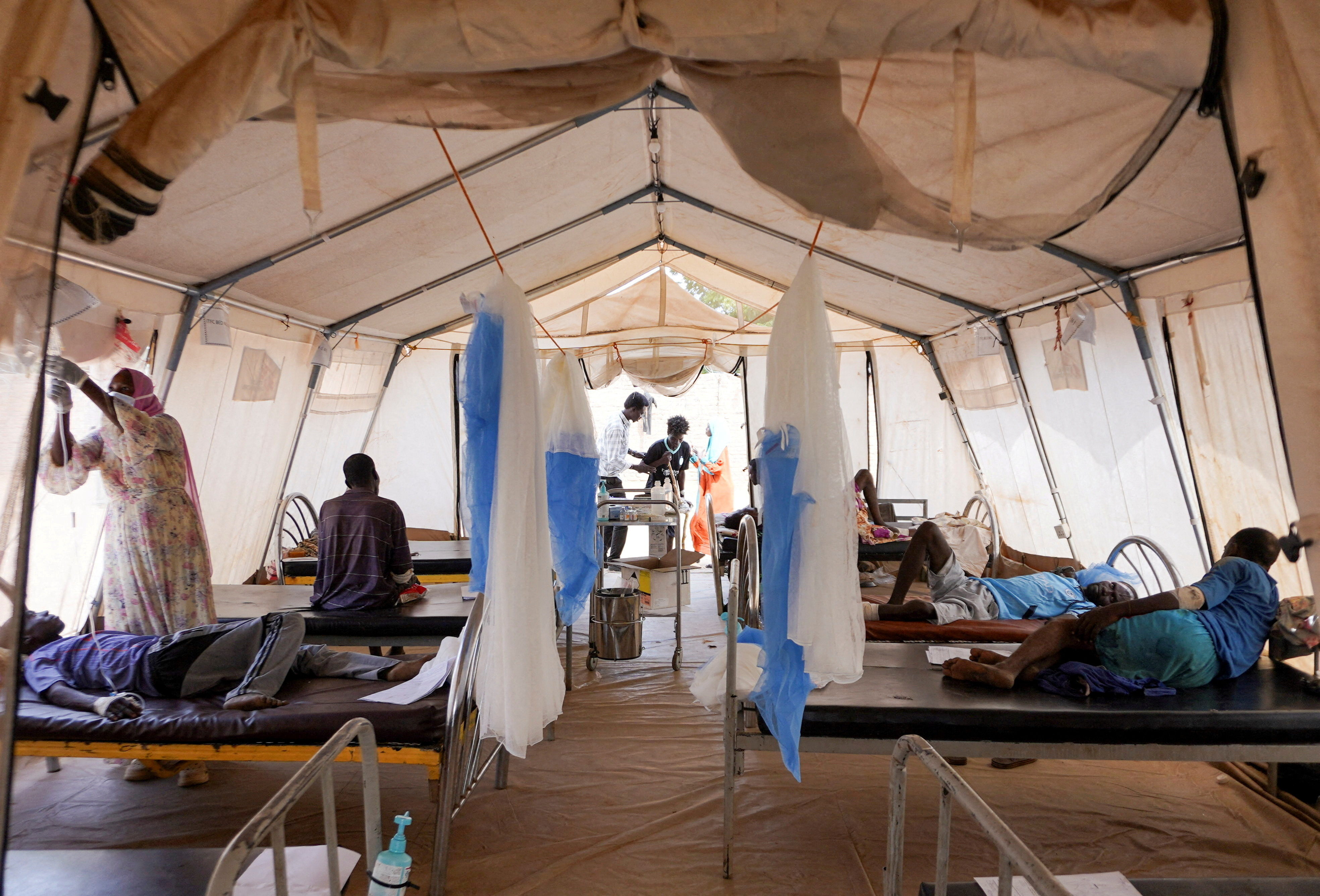 FILE PHOTO: Injured displaced Sudanese fleeing violence in al-Fashir and receiving treatment by Medecins Sans Frontieres (MSF) in Tawila