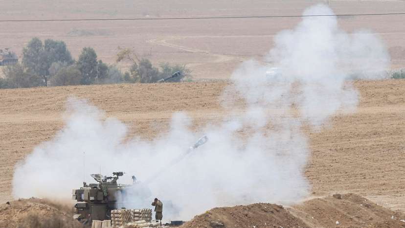Israeli artillery unit fires from the Israeli side of the Israel-Gaza border into Gaza