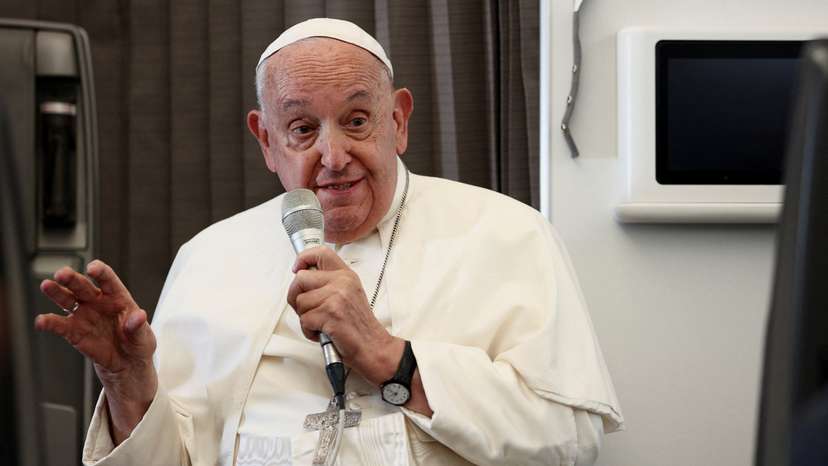 Pope Francis holds a news conference aboard the papal plane