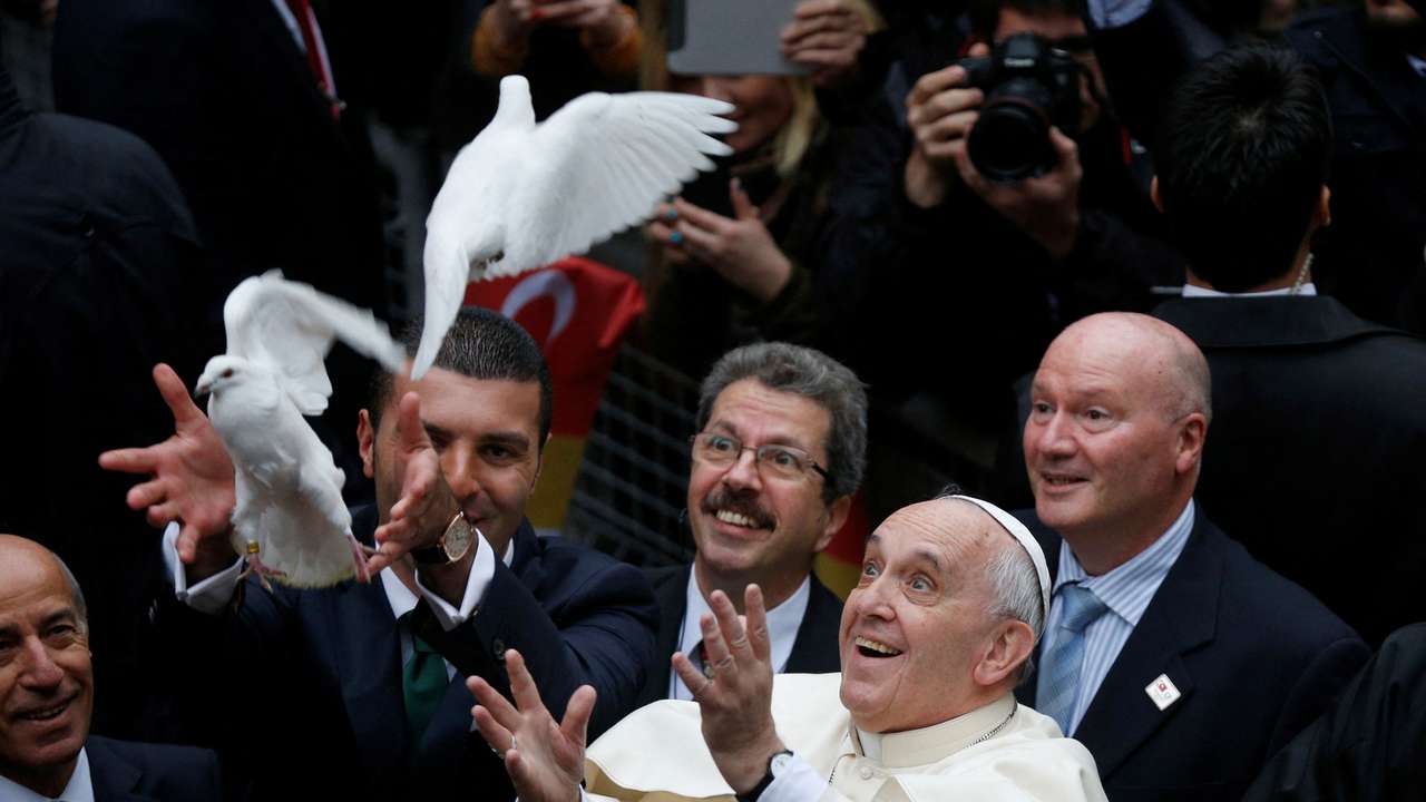 FILE PHOTO: Pope Francis releases dove prior to delivering Holy Mass at Holy Spirit Cathedral in Istanbul