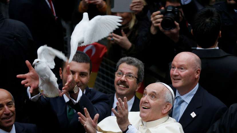 FILE PHOTO: Pope Francis releases dove prior to delivering Holy Mass at Holy Spirit Cathedral in Istanbul