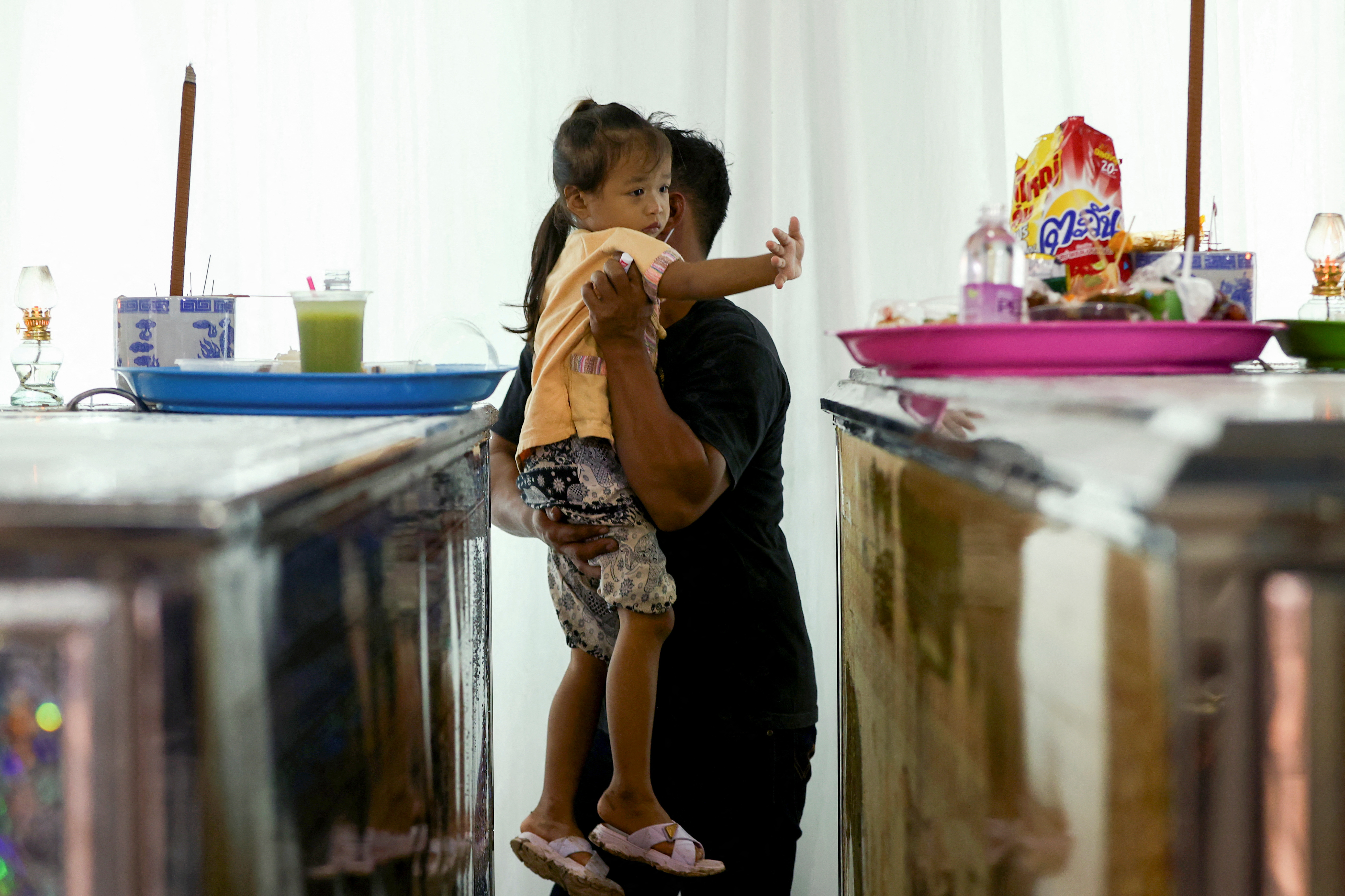 Families hold funeral for their children and teachers from Wat Khao Phraya School who have been killed in a bus which was engulfed in a fire while on a field trip in Bangkok, in Uthai Thani province