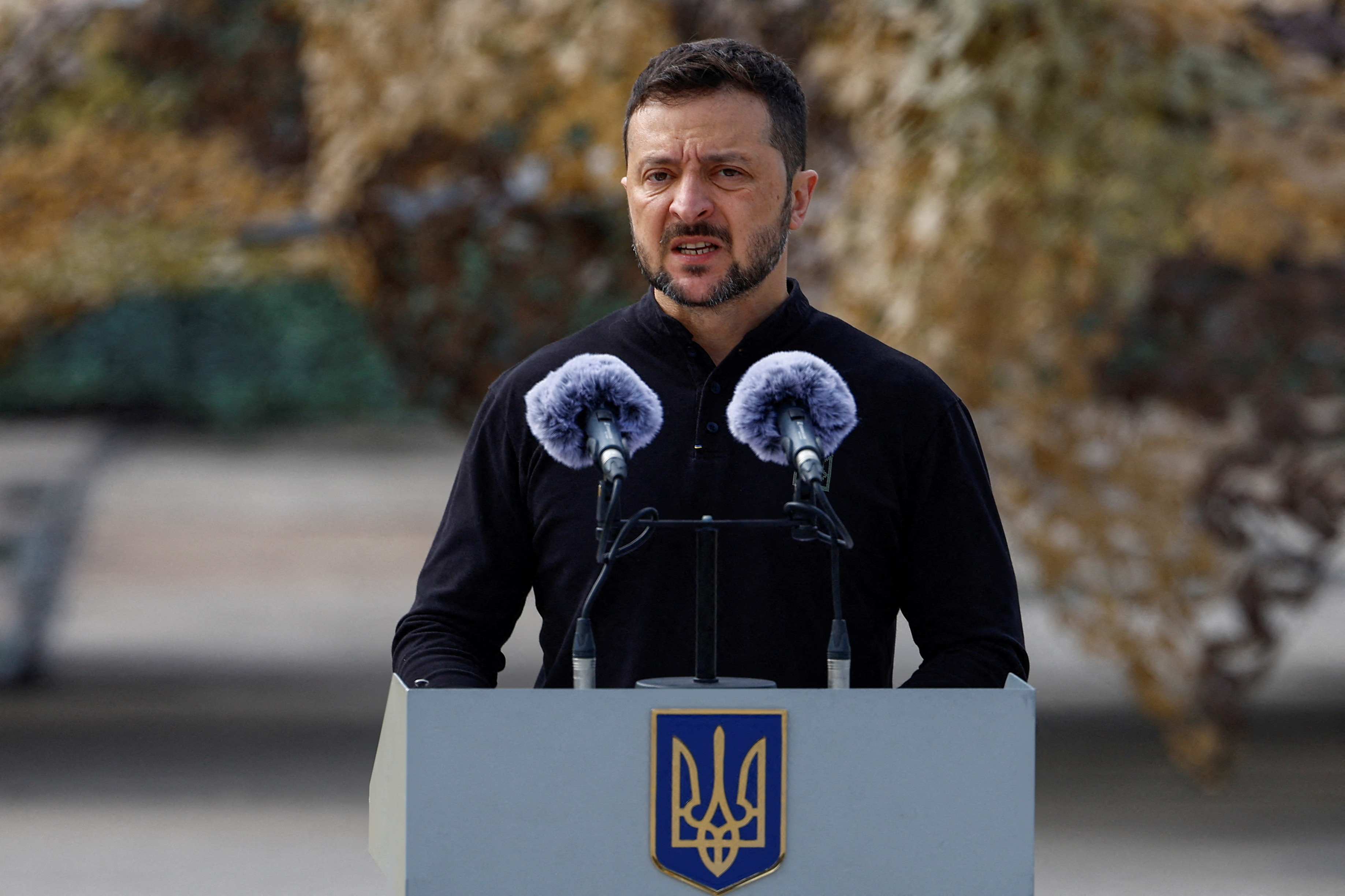 FILE PHOTO: Ukraine's President Zelenskiy speaks next to service members next to F-16 fighting aircrafts during marking the Day of the Ukrainian Air Forces in an undisclosed location in Ukraine
