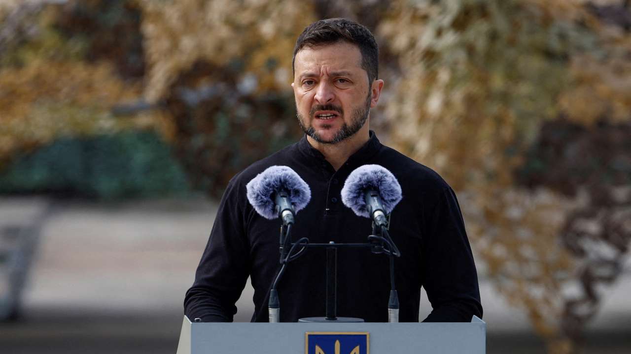 FILE PHOTO: Ukraine's President Zelenskiy speaks next to service members next to F-16 fighting aircrafts during marking the Day of the Ukrainian Air Forces in an undisclosed location in Ukraine