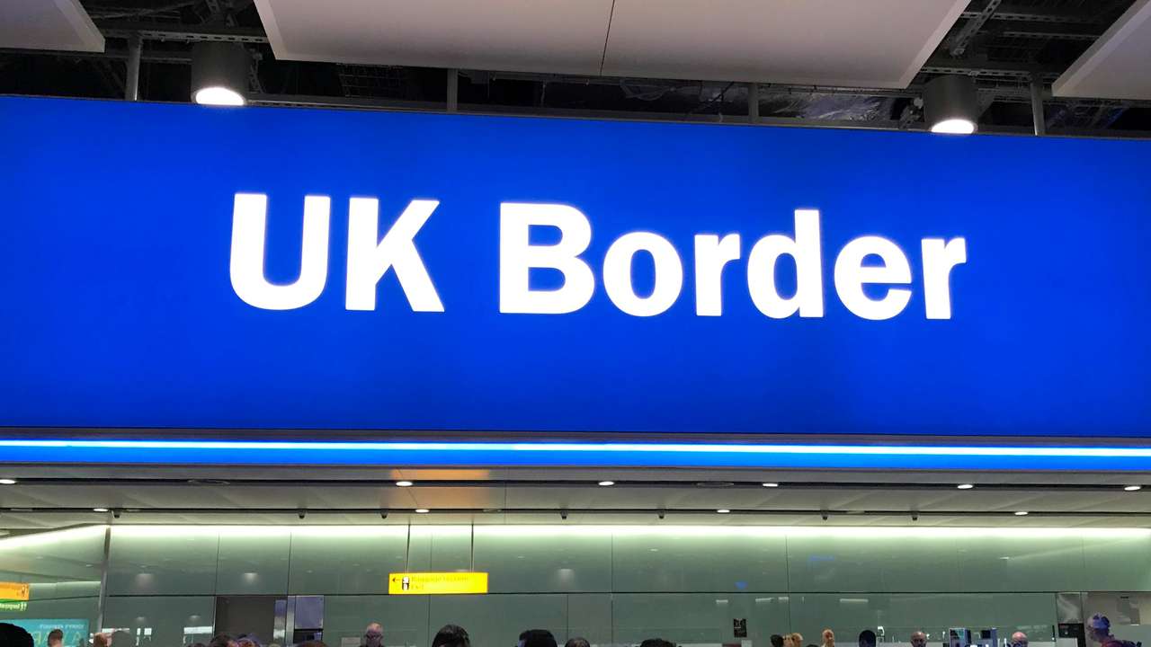 Signage is seen at the UK border control point at the arrivals area of Heathrow Airport, London