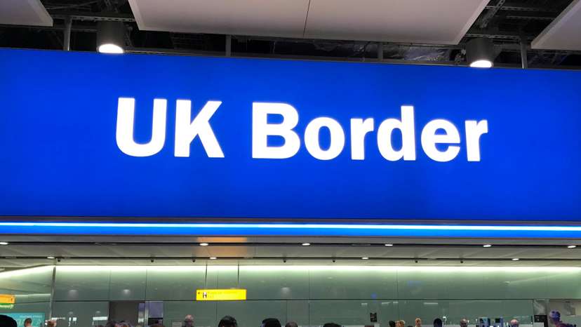 Signage is seen at the UK border control point at the arrivals area of Heathrow Airport, London
