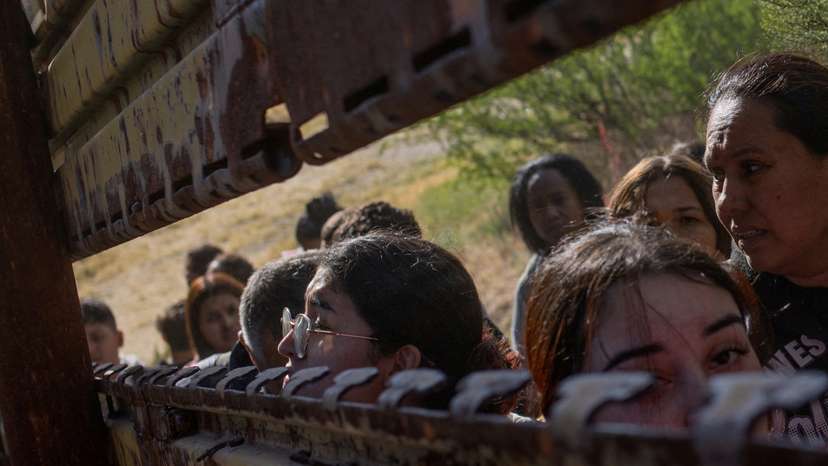 FILE PHOTO: Female migrants from South and Central America look towards U.S. from Mexico
