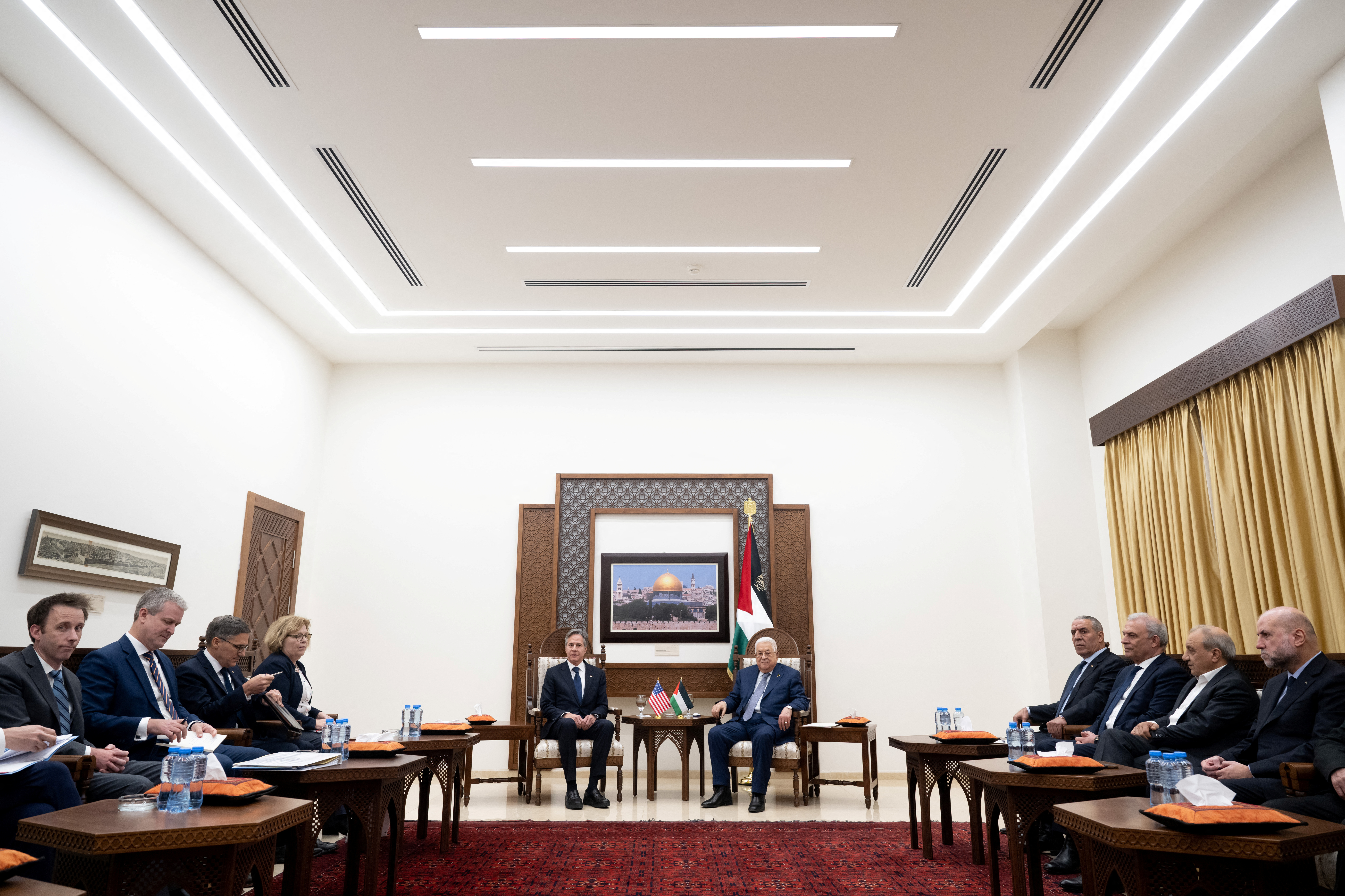 Palestinian President Mahmoud Abbas and U.S Secretary of State Antony Blinken shake hands prior to a meeting at the Muqata, the presidential compound in Ramallah