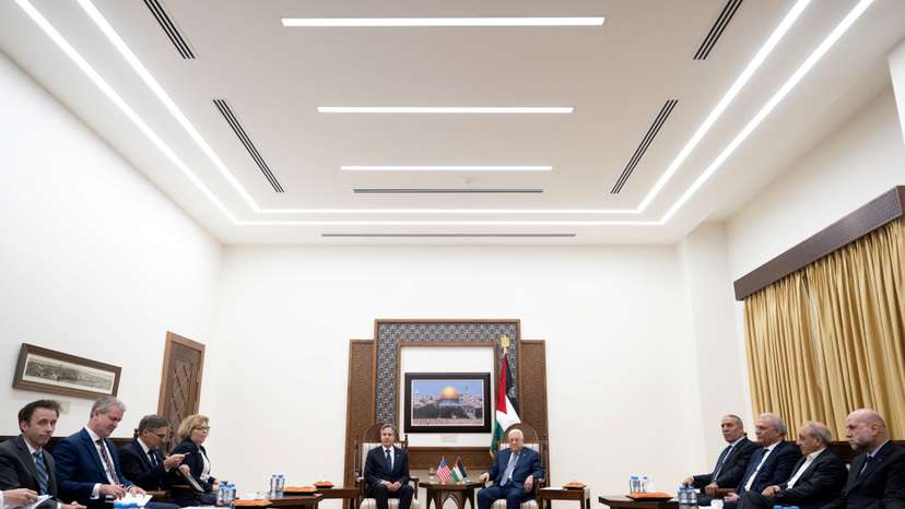 Palestinian President Mahmoud Abbas and U.S Secretary of State Antony Blinken shake hands prior to a meeting at the Muqata, the presidential compound in Ramallah