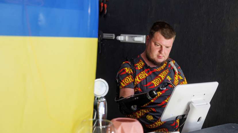 Ukrainian veteran Valerii Kucherenko works inside of his pizzeria in Bila Tserkva