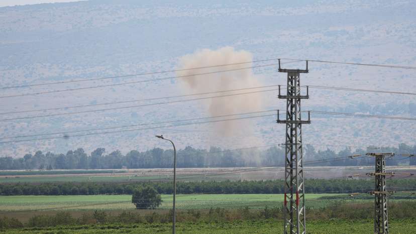 Smoke rises above the Israeli-occupied Golan Heights