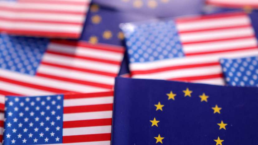 Illustration shows U.S. and EU flags