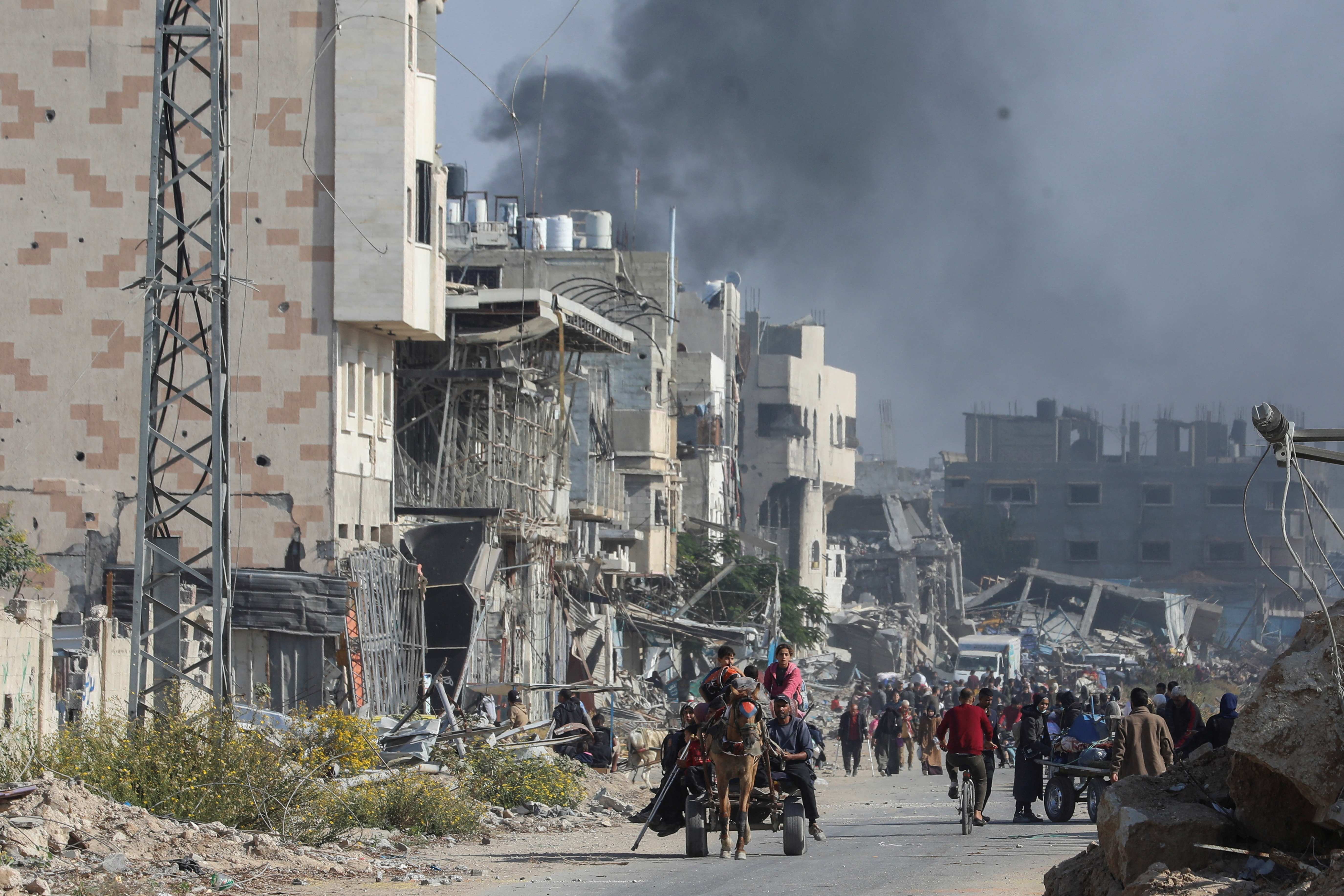 Displaced Palestinians flee the northern part of Gaza amid an Israeli military operation, in Gaza City