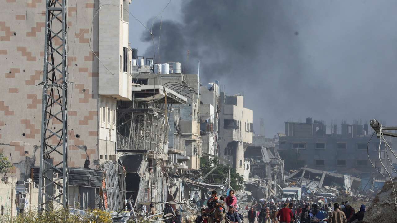 Displaced Palestinians flee the northern part of Gaza amid an Israeli military operation, in Gaza City