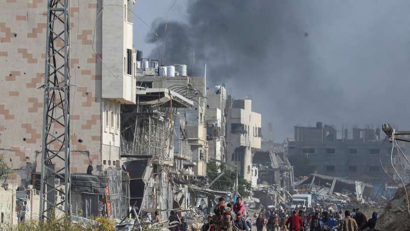 Displaced Palestinians flee the northern part of Gaza amid an Israeli military operation, in Gaza City