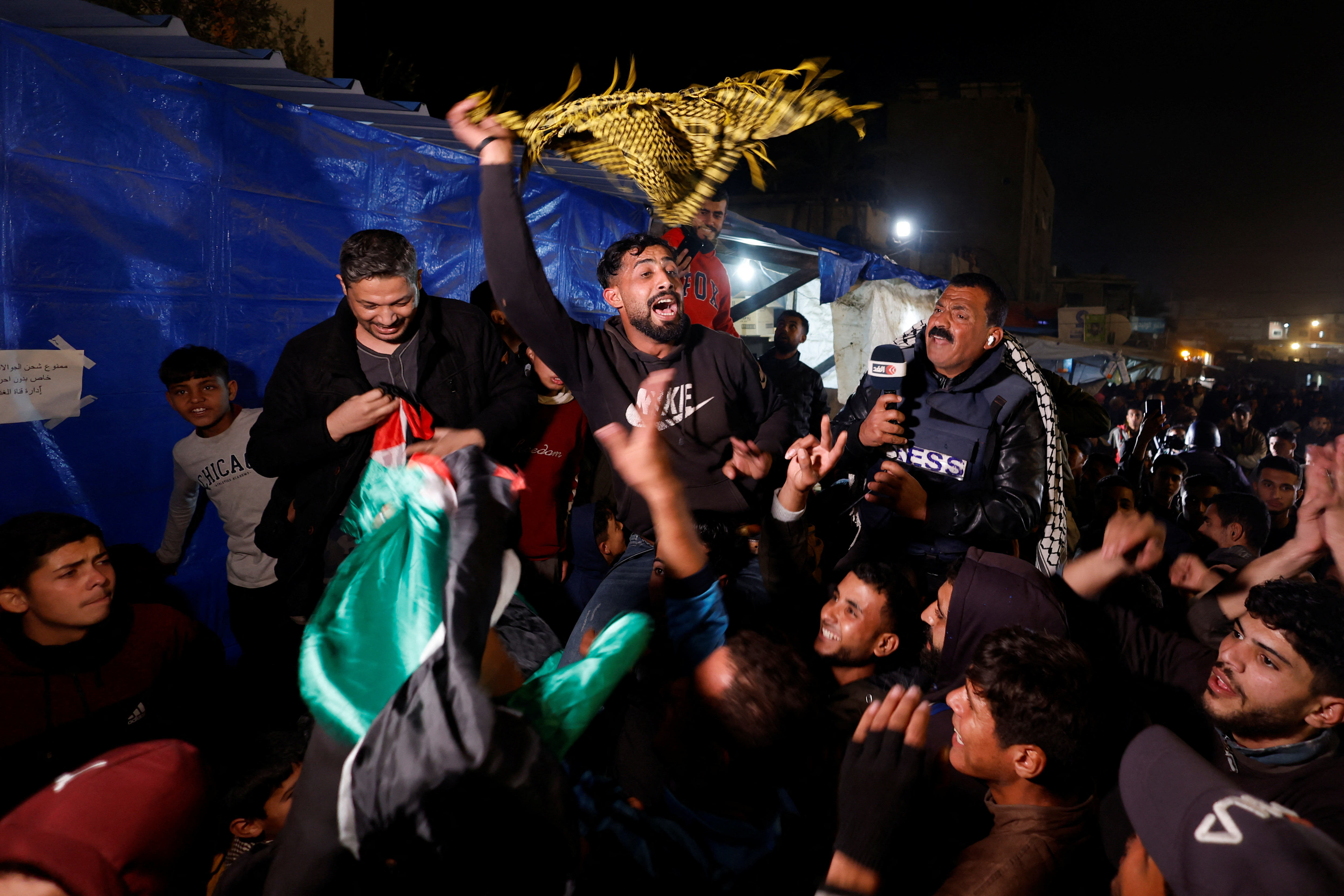 Palestinians react to news on a ceasefire deal with Israel, in Khan Younis in the southern Gaza Strip