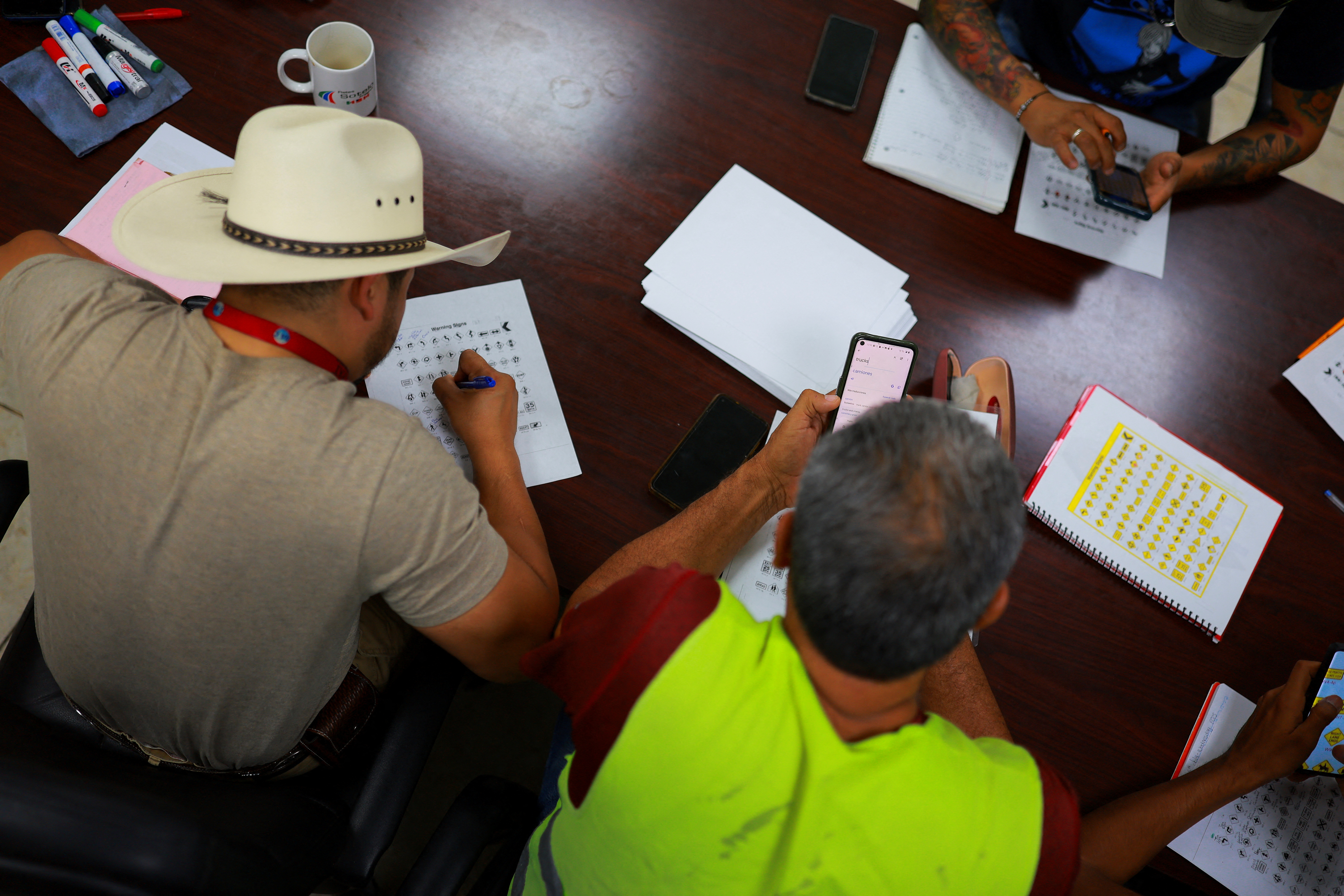 Mexican truck drivers study English to comply with new U.S. language rules