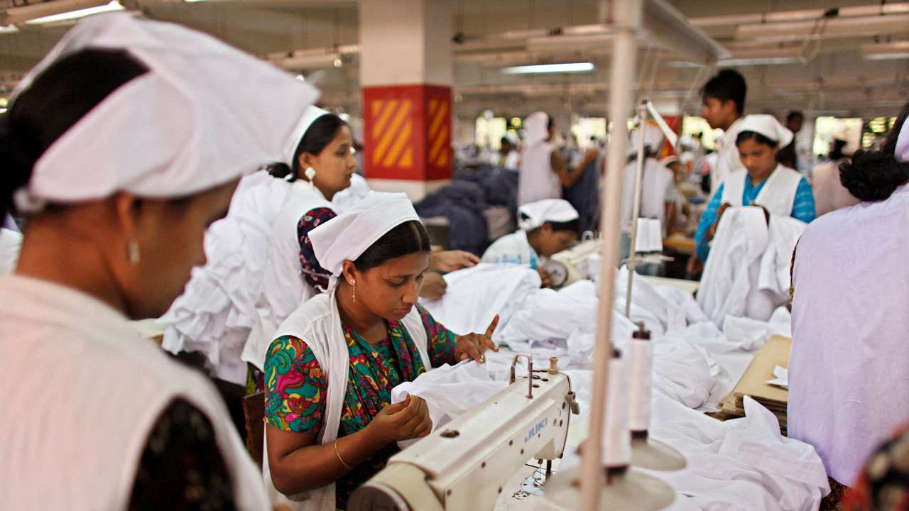 FILE PHOTO: Women work at a garment factory in Gazipur