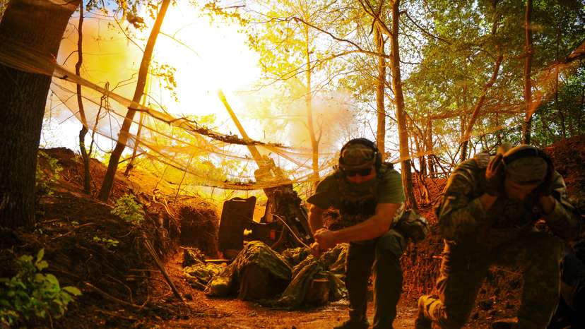 Ukrainian servicemen fire a self-propelled Howitzer towards Russian troops in a front line in Kharkiv region