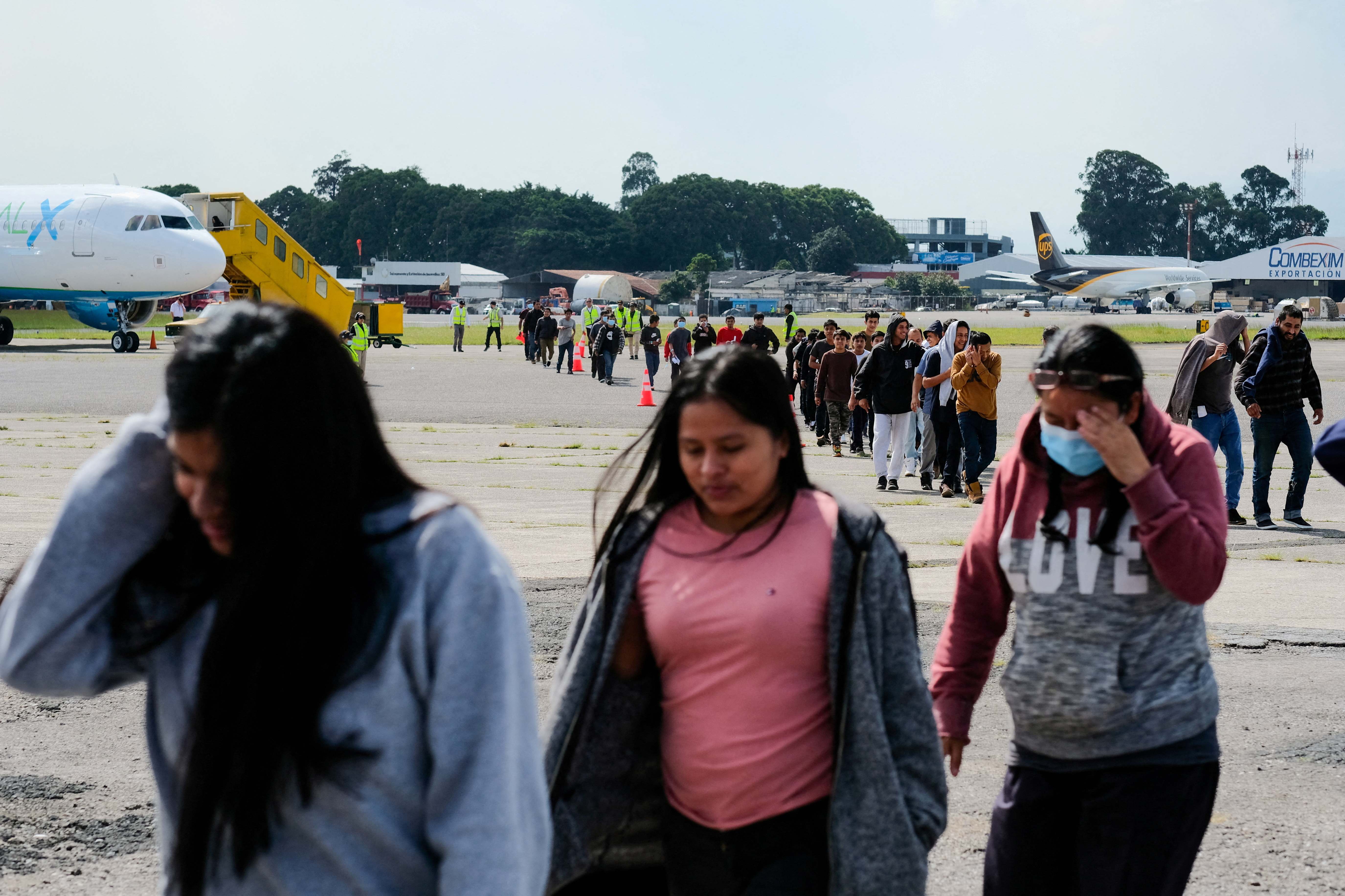 FILE PHOTO: Guatemalan migrants arrive on a deportation flight from the U.S., in Guatemala City