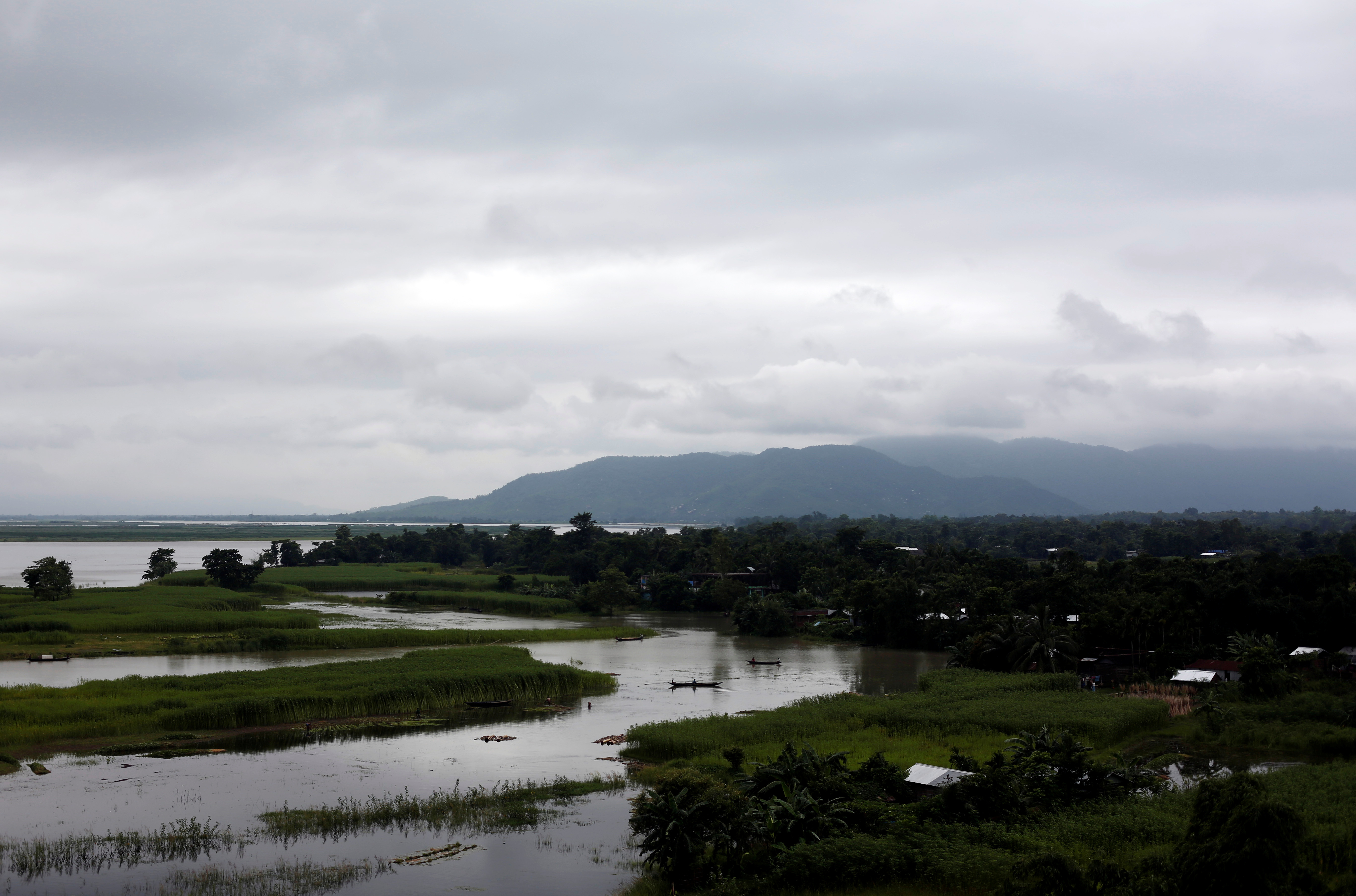 FILE PHOTO: Boats are seen in the Brahmaputra river in Jogighopa