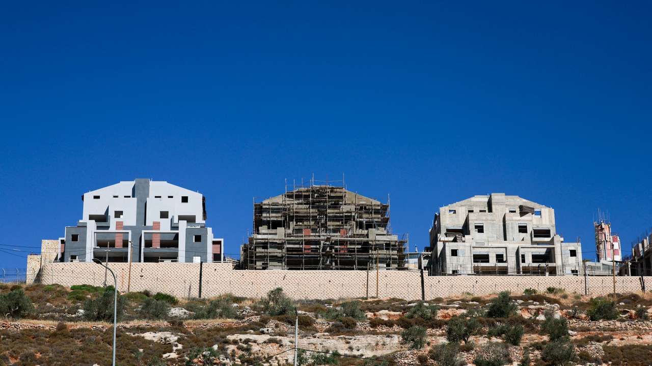FILE PHOTO: New buildings stand around the Israeli settlement Migdalim near Nablus, in the Israeli-occupied West Bank