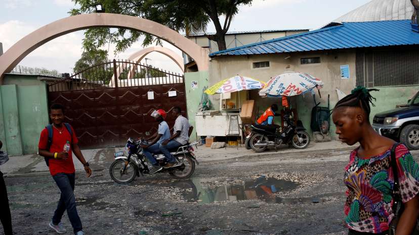 FILE PHOTO: People walk past Bernard Mevs Hospital in Port-au-Prince