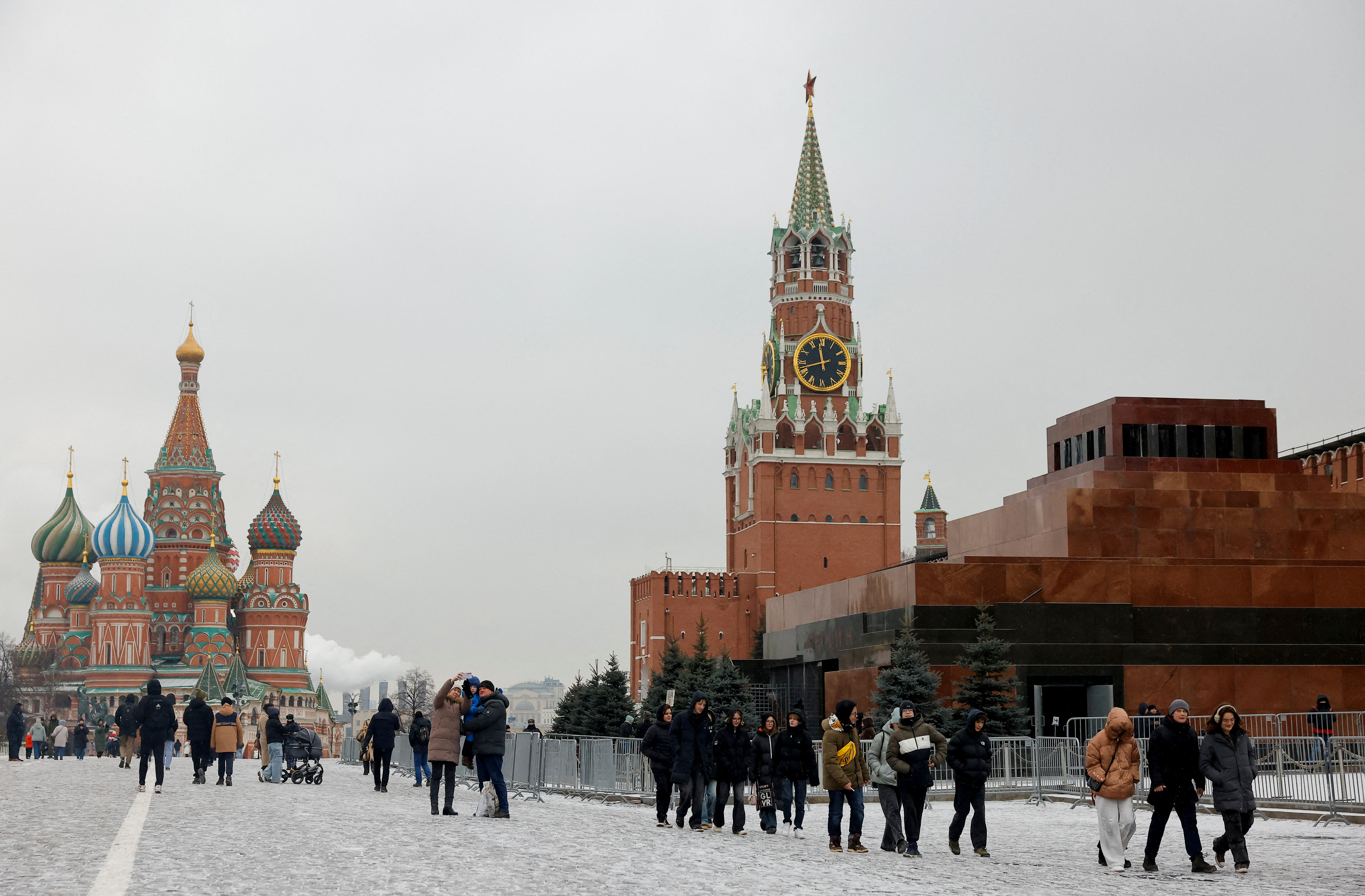 FILE PHOTO: People walk in Red Square in central Moscow
