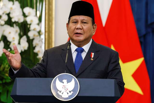 Indonesian President Prabowo Subianto speaks during a press conference with Vietnam's Communist Party General Secretary To Lam (not pictured), at the Merdeka Palace in Jakarta, Indonesia, March 10, 2025. REUTERS/Ajeng Dinar Ulfiana