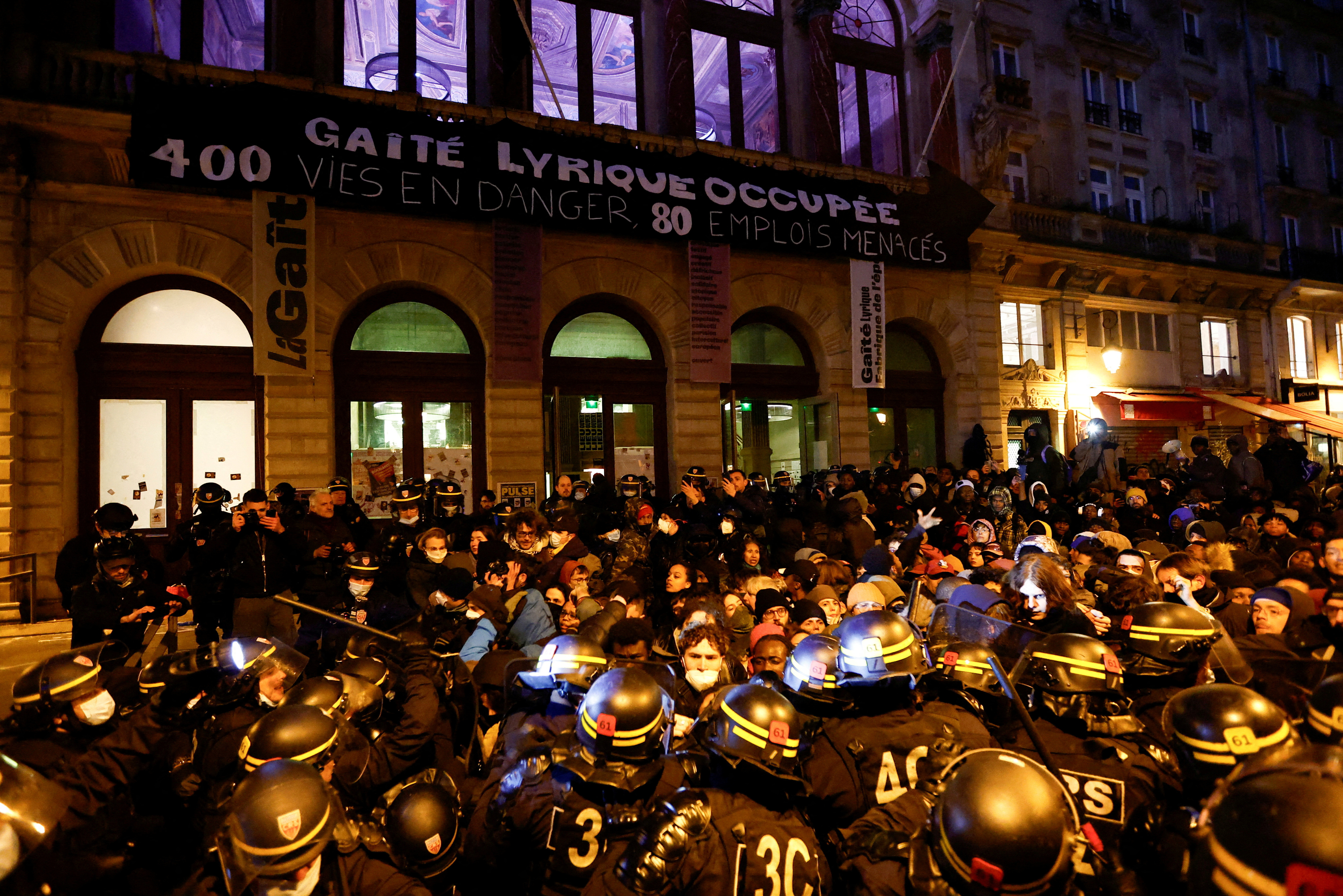 Police evict migrants from a Paris theatre