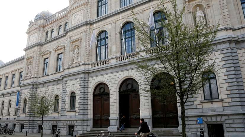FILE PHOTO: A cyclist rides past a building of Ghent University