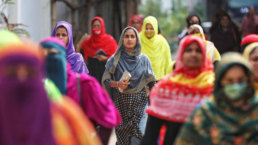 Garment workers come out of a factory during lunch hours at the Ashulia area, outskirts of Dhaka