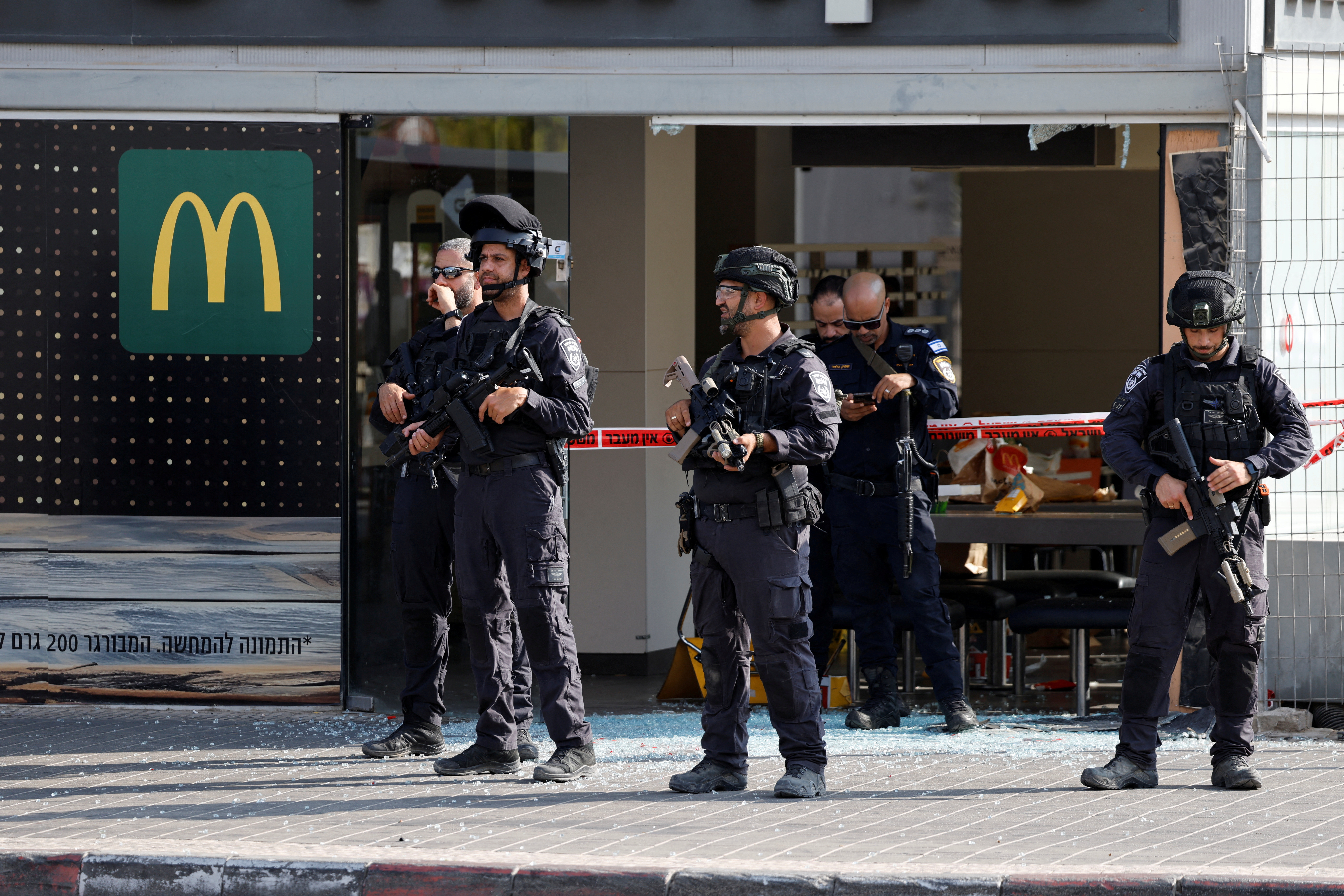 Israeli police work at the scene of an attack in Beersheba
