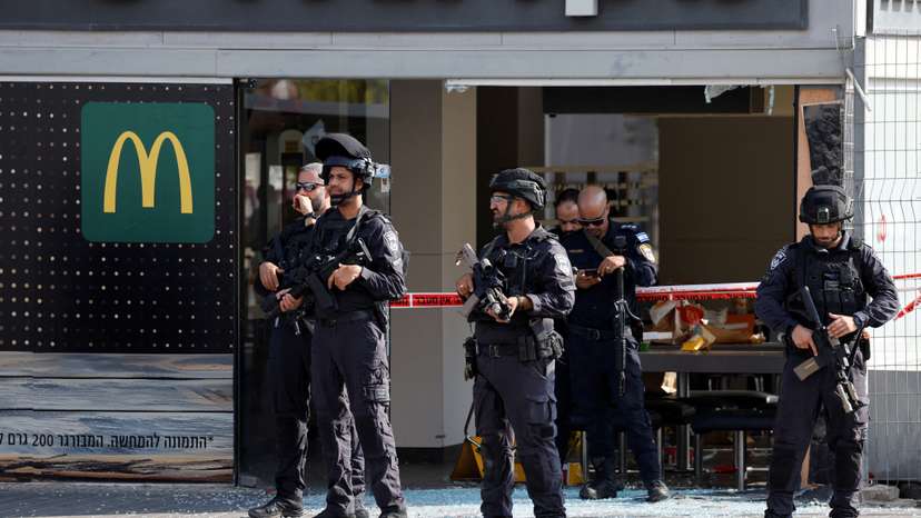 Israeli police work at the scene of an attack in Beersheba