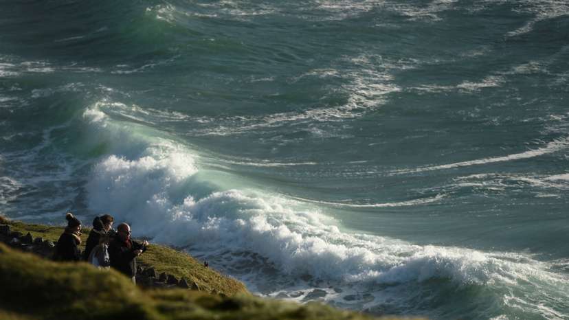 FILE PHOTO: People look out to the Atlantic ocean from Slea Had in Ventry