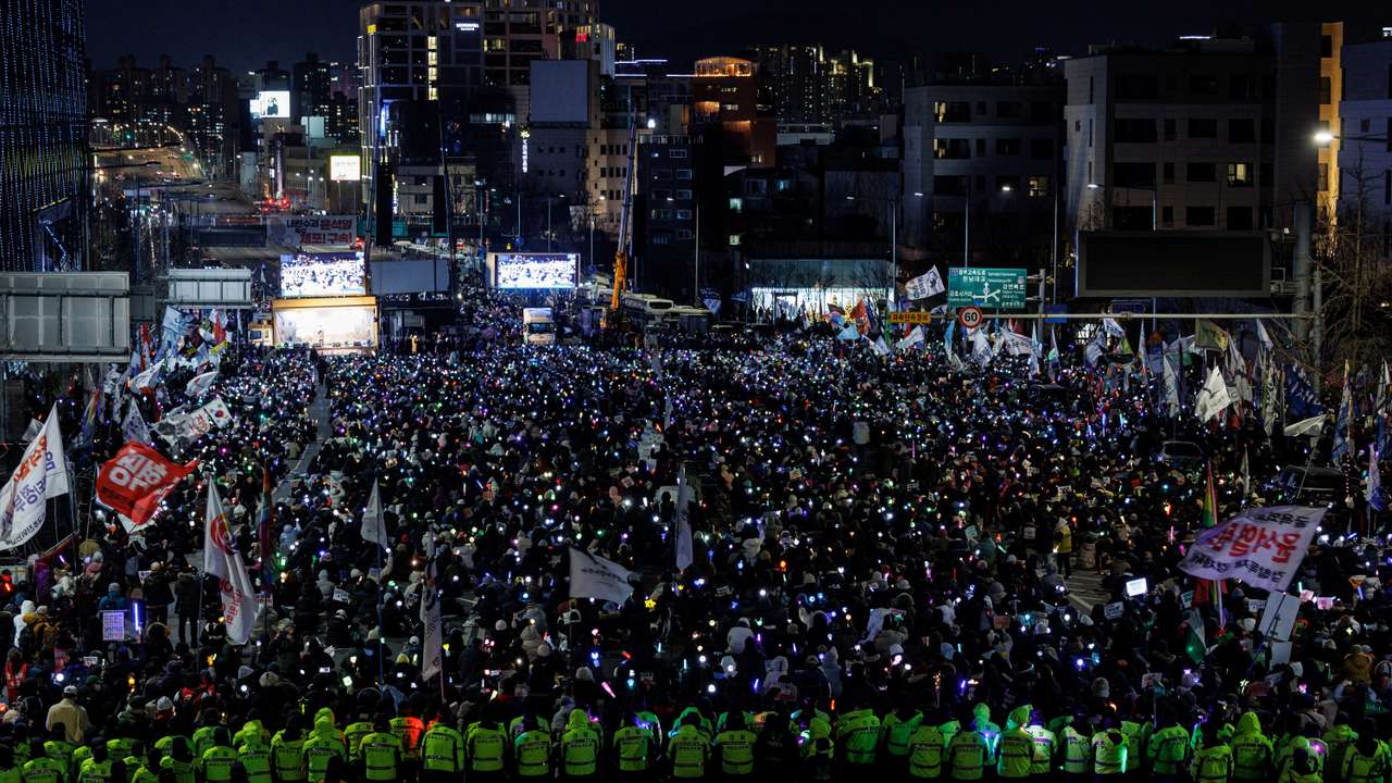 People take part in a protest against the impeached South Korean President Yoon Suk Yeol near his official residence, in Seoul