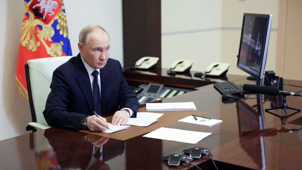 Russian President Putin chairs a meeting with members of the government via video link at a residence outside Moscow