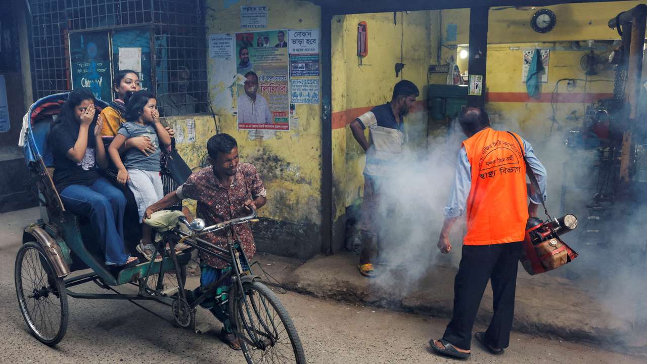 FILE PHOTO: A city corporation worker sprays fumigator to control mosquitoes, as number of dengue infected patients increase, in Dhaka