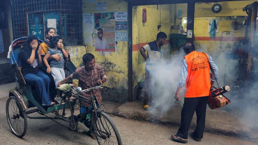 FILE PHOTO: A city corporation worker sprays fumigator to control mosquitoes, as number of dengue infected patients increase, in Dhaka