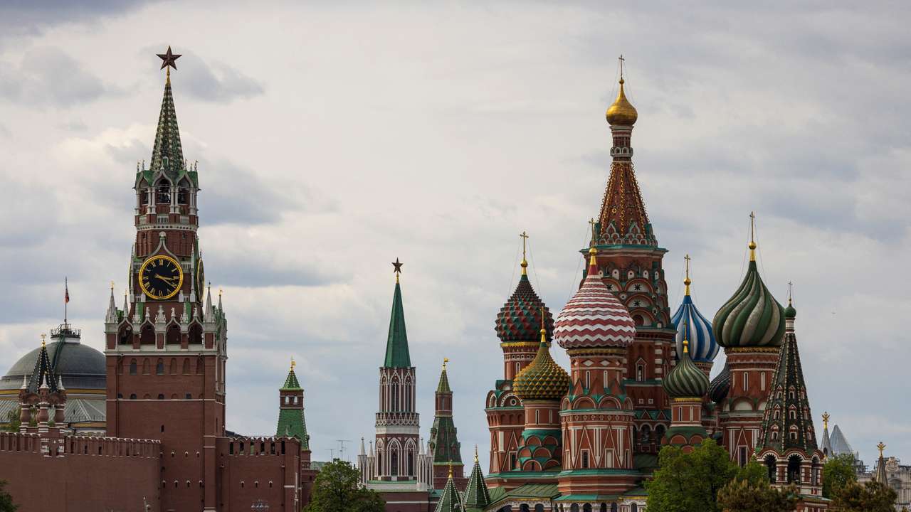 A general view on the Spasskaya tower of the Kremlin and St. Basil's Cathedral in Moscow
