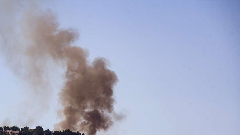 FILE PHOTO: Smoke rises on the Israeli side of its border with Lebanon following a rocket that was launched from Lebanon and fired towards Israel