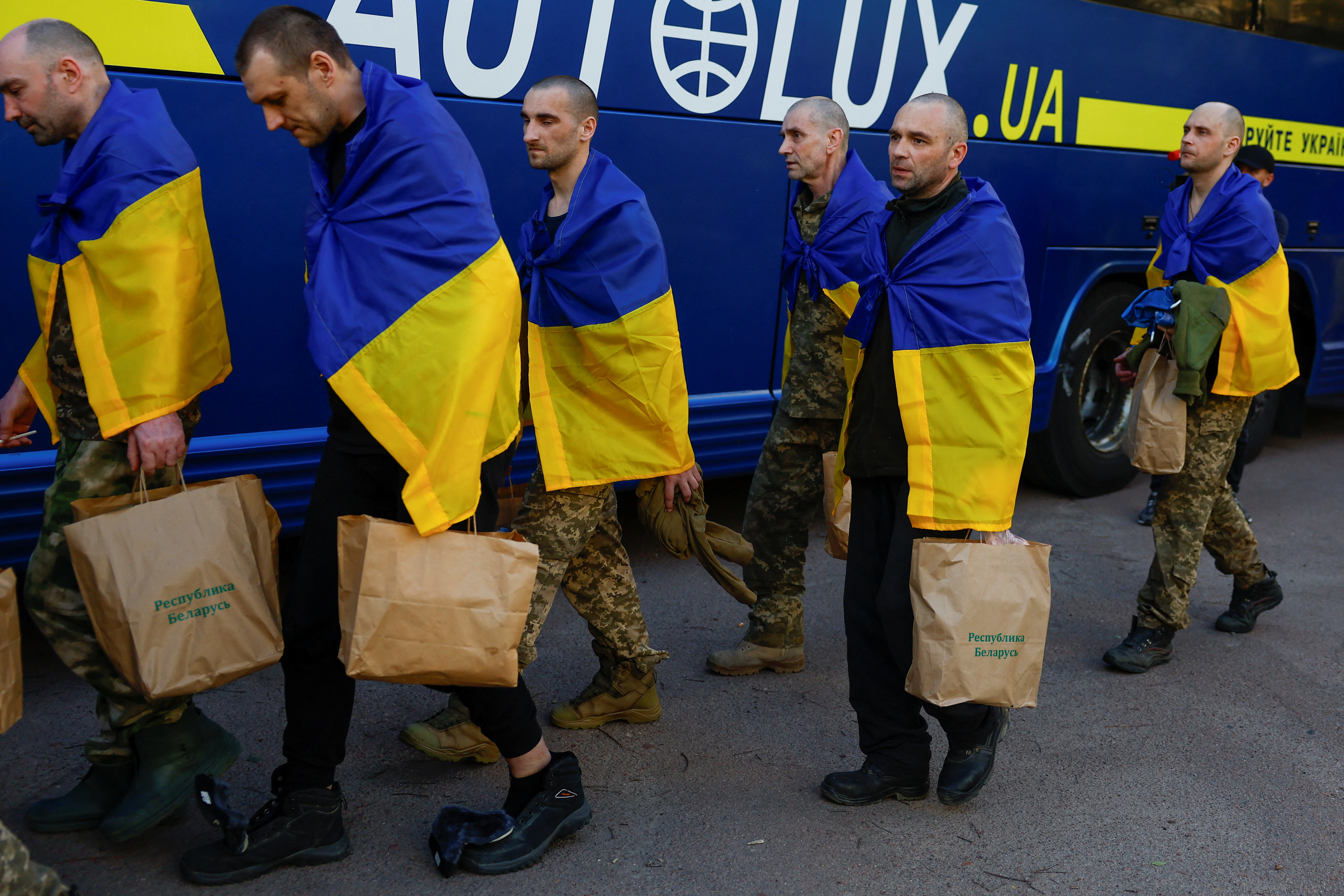 Ukrainian prisoners of war are seen as they return after a swap in an undisclosed location in Ukraine
