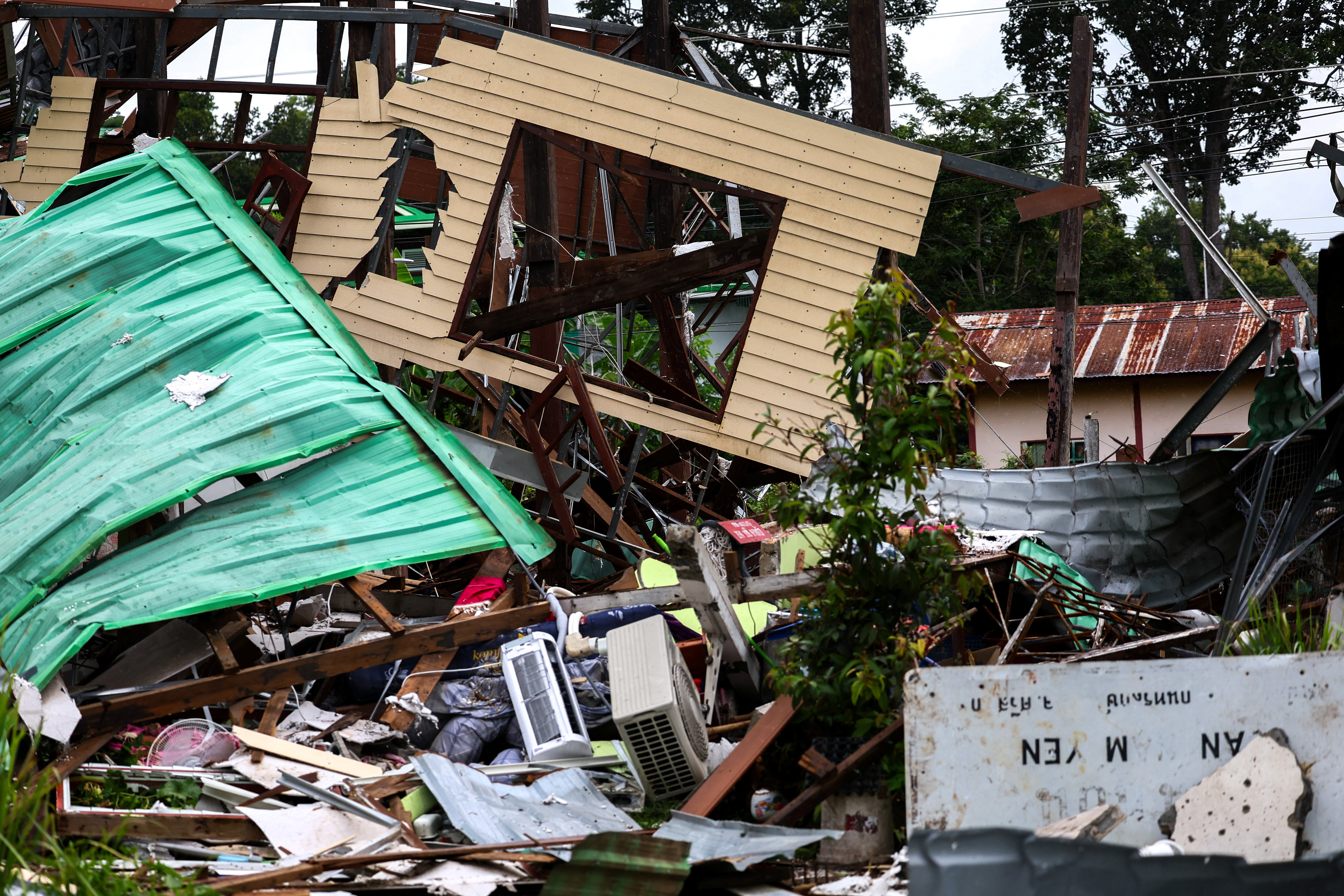 A house damaged by Cambodia's shelling is pictured in Sisaket province, ahead of a ceasefire talks in Malaysia on the deadly border conflict between Thailand and Cambodia