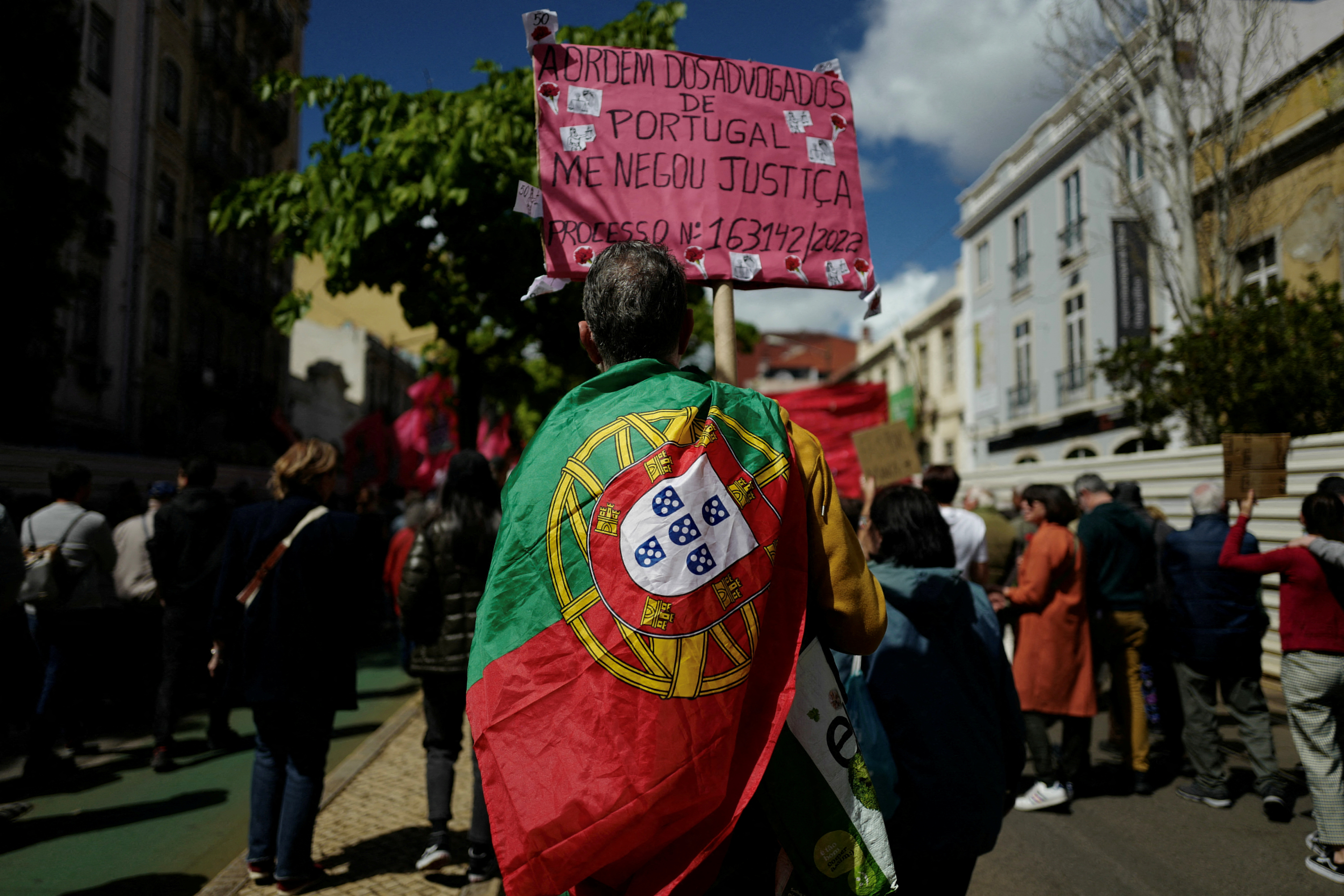 FILE PHOTO: People participate in a march on May Day celebrating Labour Day in Lisbon