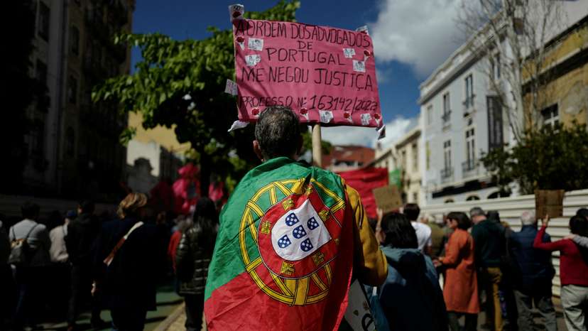 FILE PHOTO: People participate in a march on May Day celebrating Labour Day in Lisbon