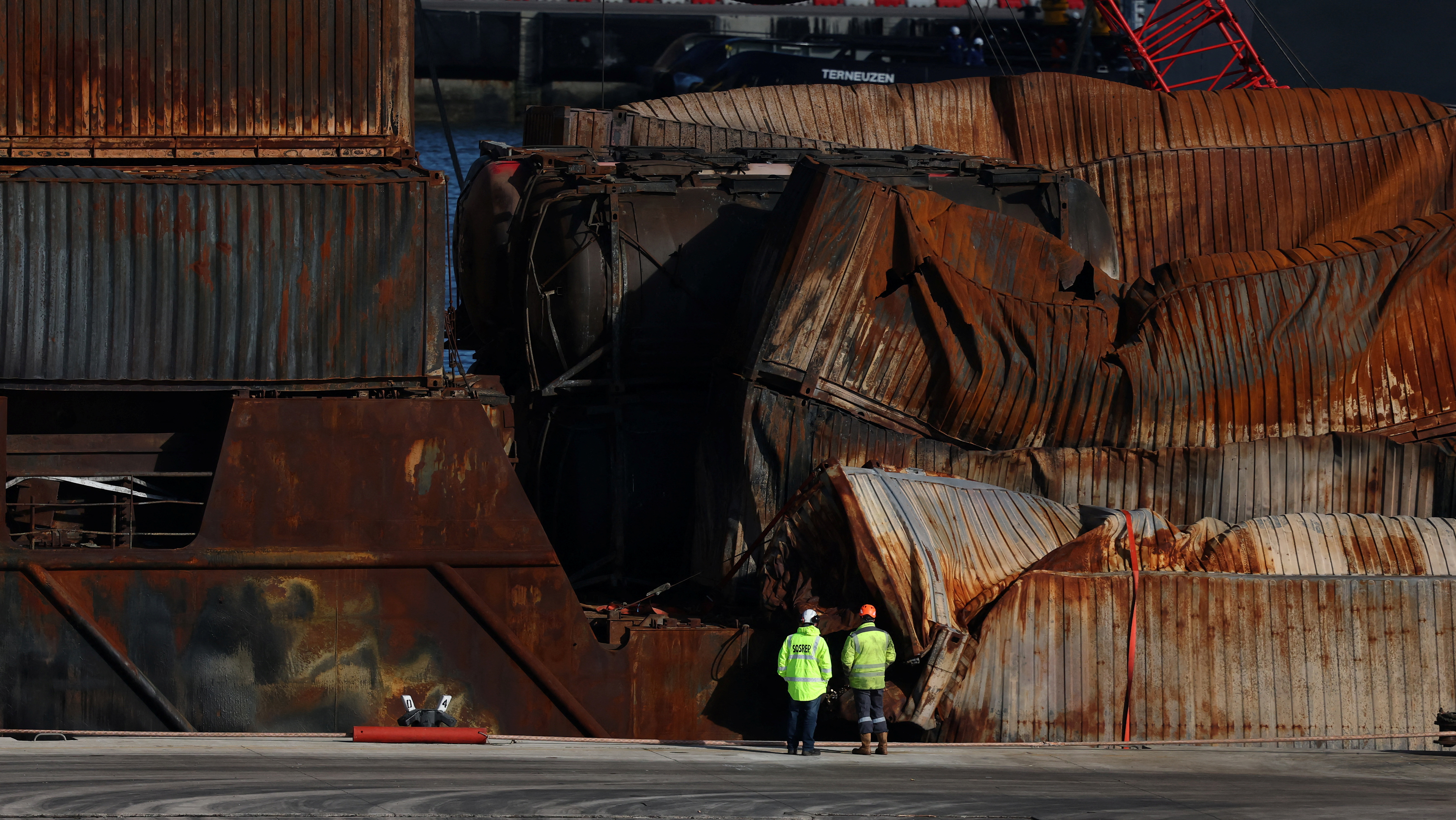 Salvage workers examine Solong container ship in Aberdeen