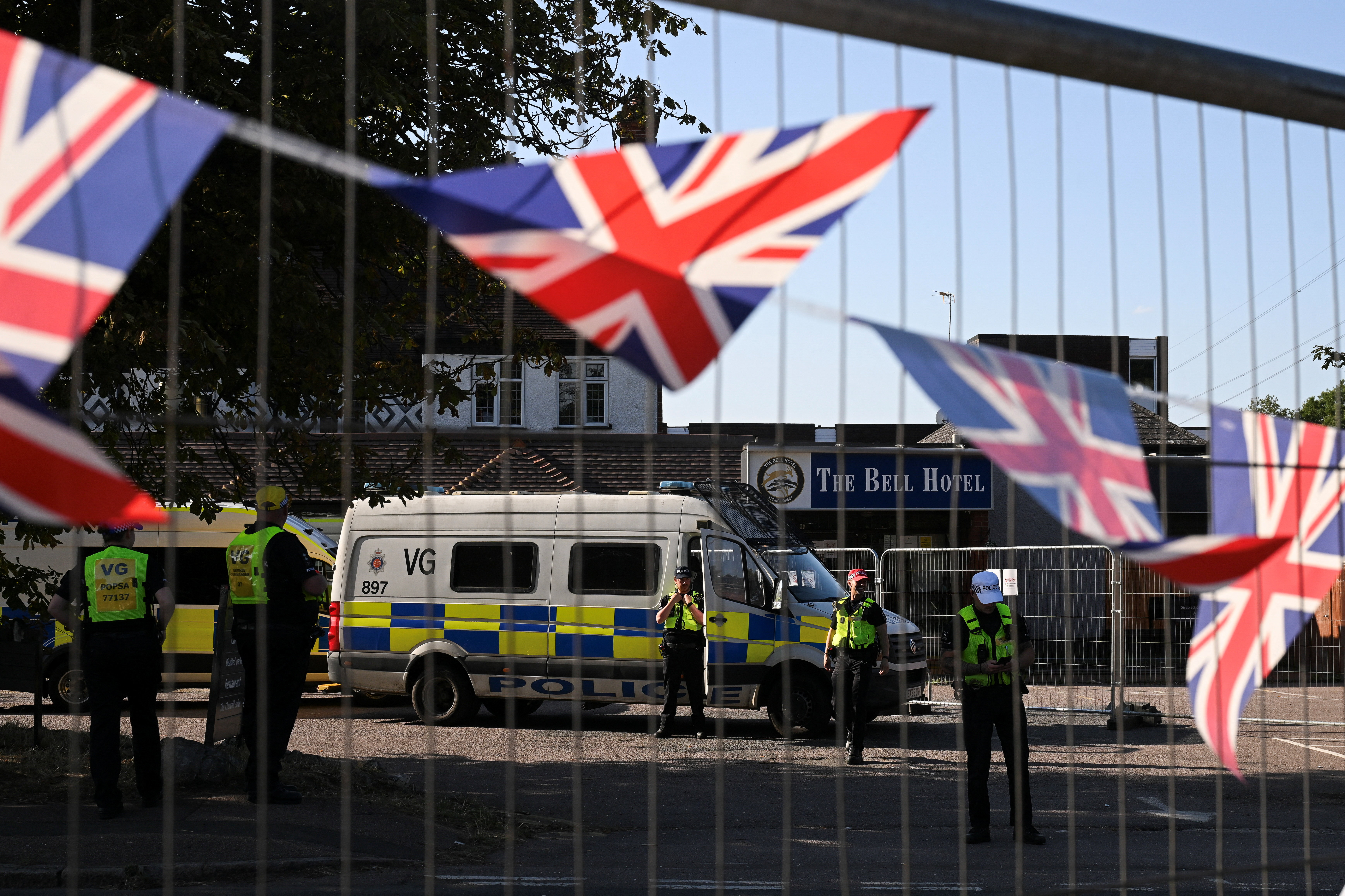 Protesters gather at migrant hotels in cities across Britain