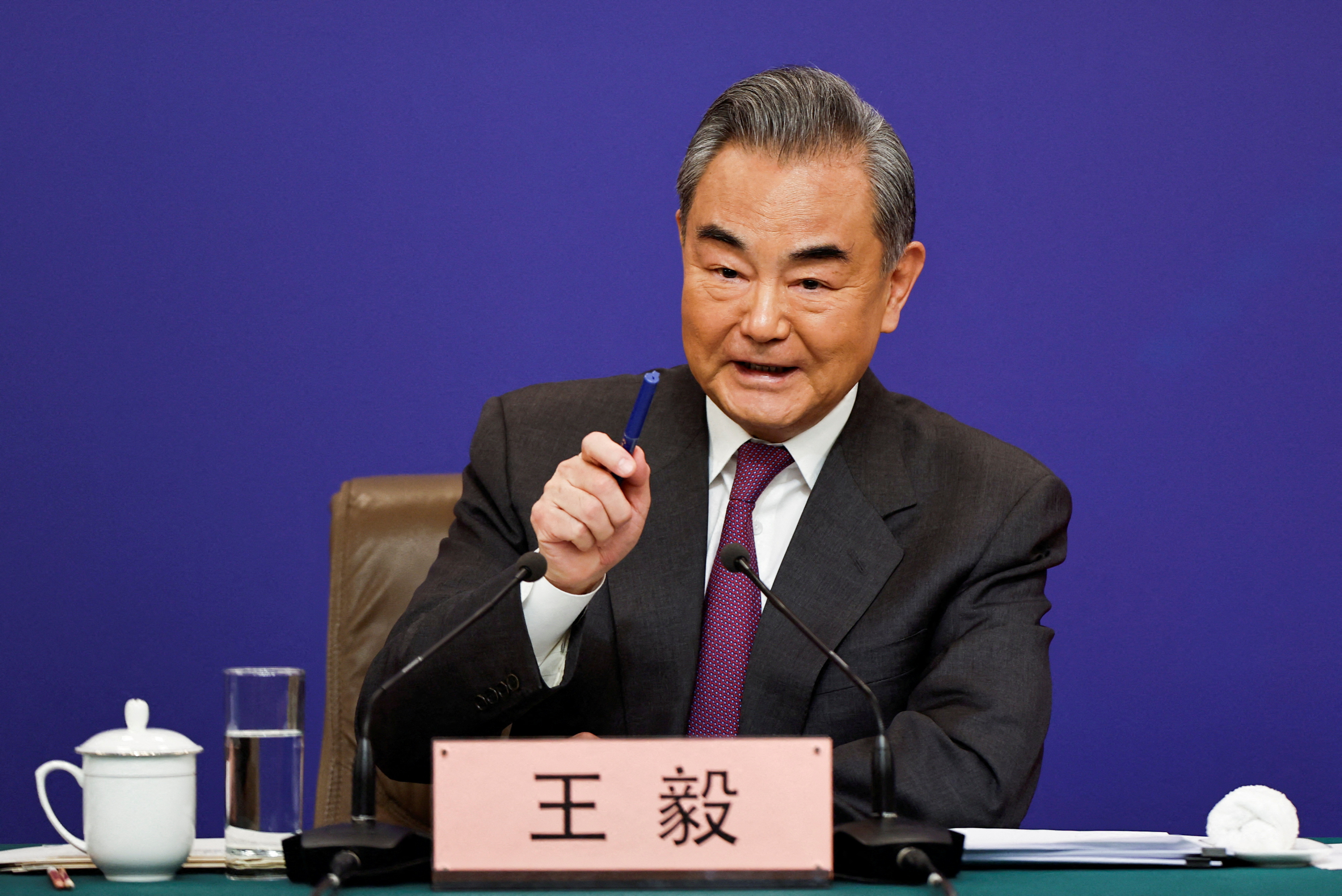 FILE PHOTO: Chinese Foreign Minister Wang Yi attends a press conference on the sidelines of the NPC, in Beijing