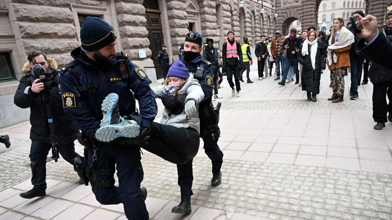 Greta Thunberg and other climate activists demonstrate outside parliament in Stockholm